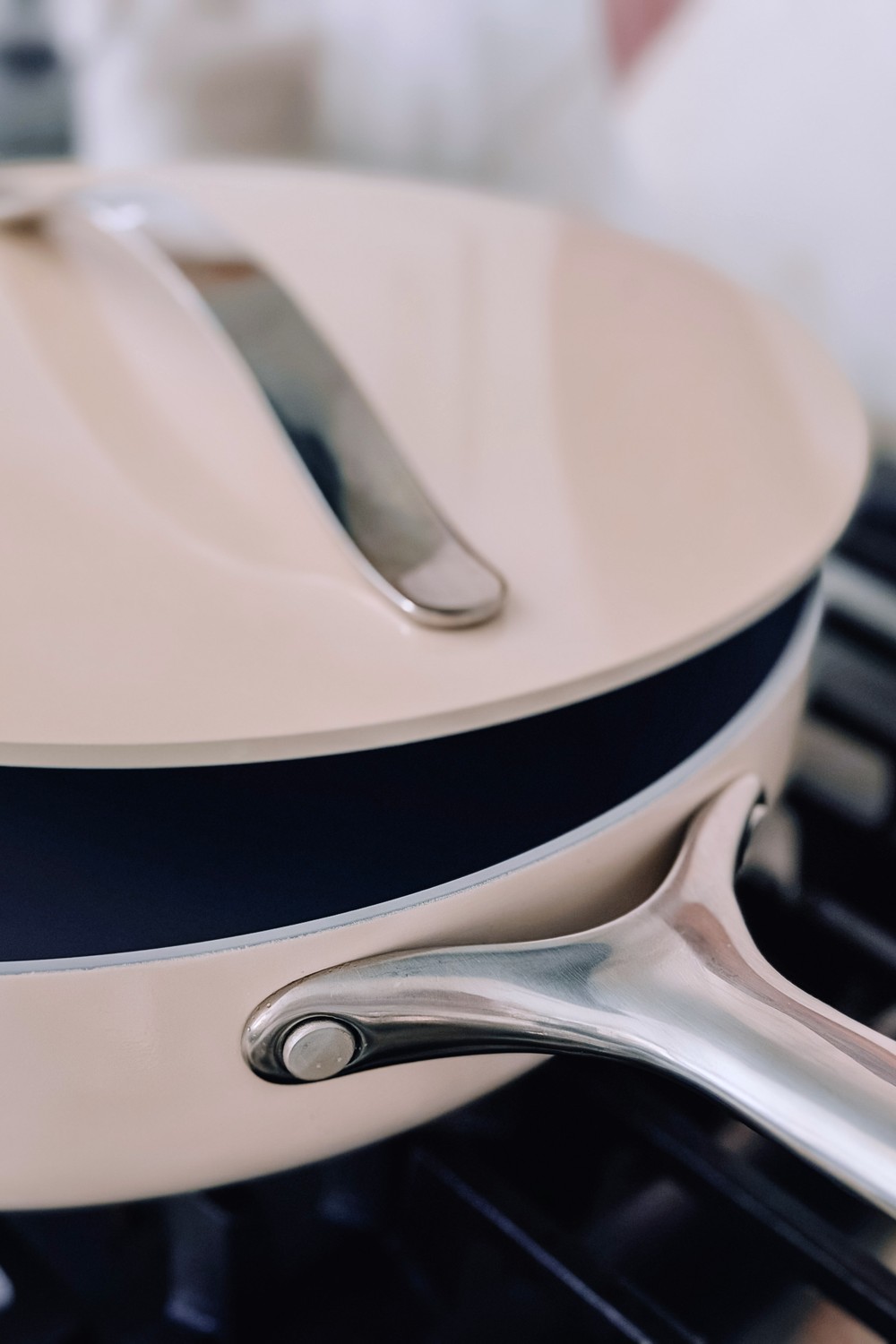 Close up of the Caraway sauté pan lid and polished stainless steel handle